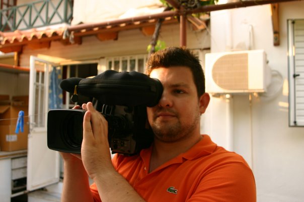 a man carrying a cameraa man carrying a camera